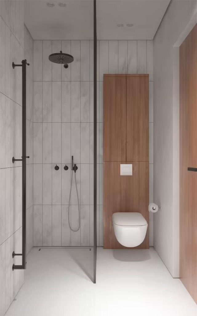Deze kleine luxe badkamer is ontworpen door KDVA Architects, met een ruime inloopdouche naast het toilet.